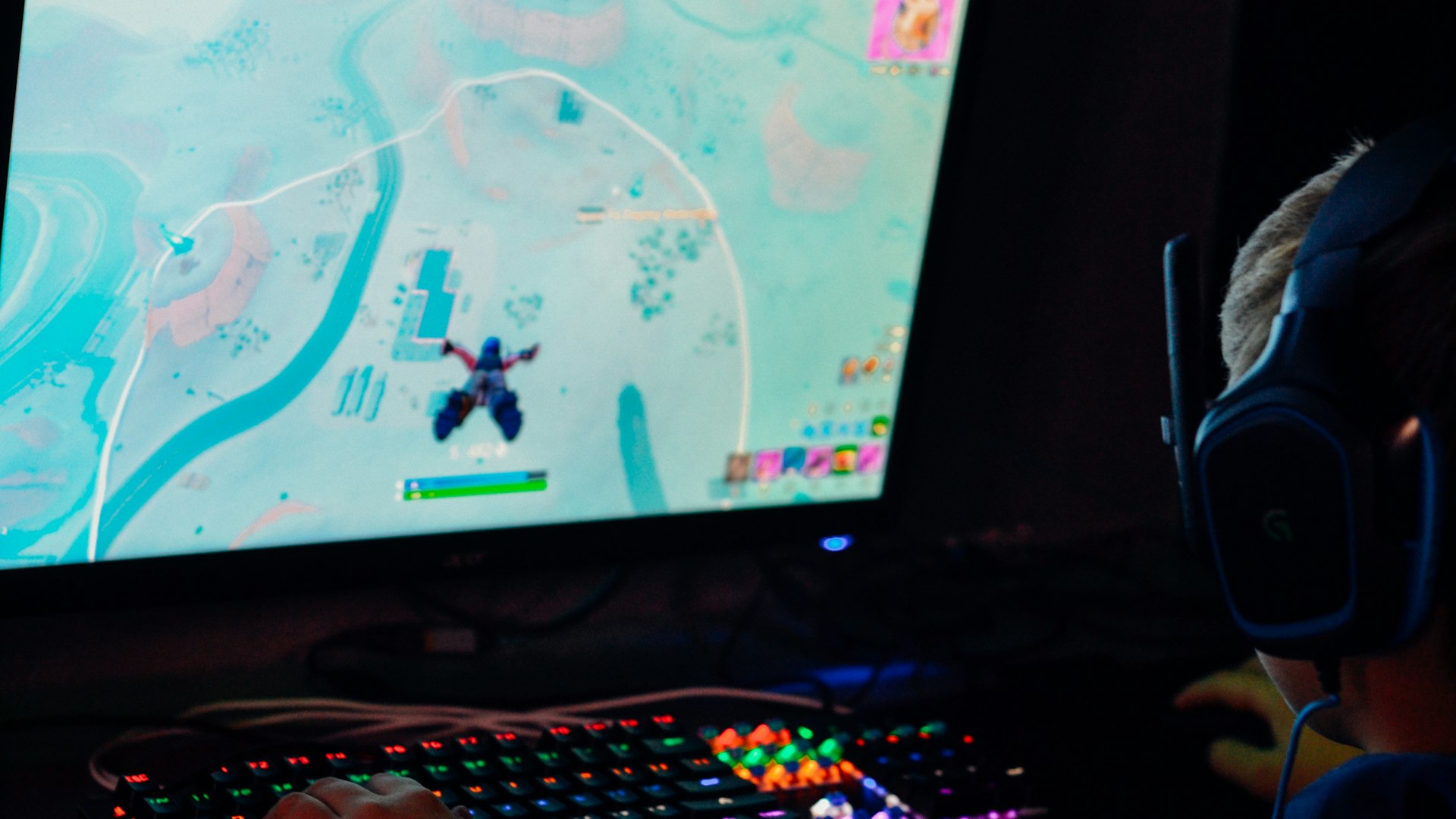 Esports arena bathed in blue light during a live raid tournament
